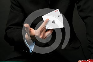 Young lucky gambler with cards