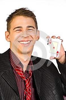 Young lucky gambler with cards