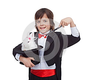 Young magician boy with cute rabbit in his magic hat