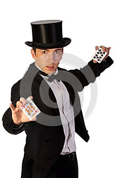 Young magician performing with cards