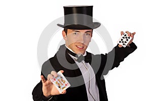 Young magician performing with cards