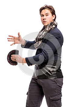 Young magician showing trick with playing cards