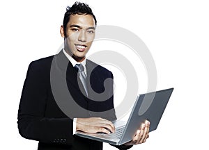 Young malay entrepreneur with laptop computer