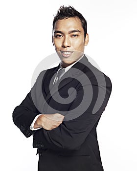 Young Malay man in black suit and confident smile