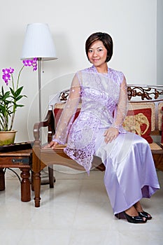 Young Malay woman in pink baju kurung,