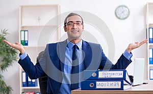 Young male accountant working in the office