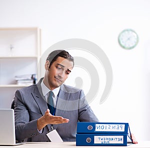 Young male accountant working in the office