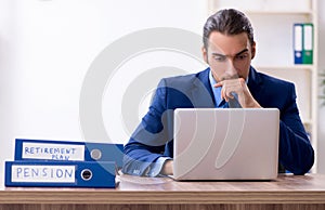 Young male accountant working in the office