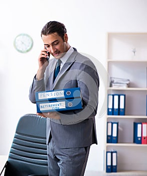 Young male accountant working in the office