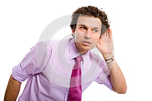 Young male adult listening carefully, spying photo