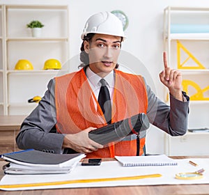 Young male architect working in the office