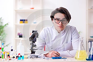 The young male biochemist working in the lab