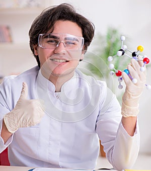 Young male biochemist working in the lab