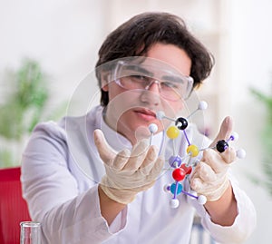 Young male biochemist working in the lab