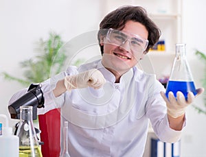 Young male biochemist working in the lab