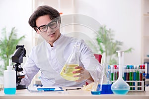 Young male biochemist working in the lab