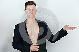 Young male in black suit with naked torso