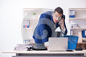 Young male businessman working in the office