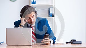 Young male businessman working in the office