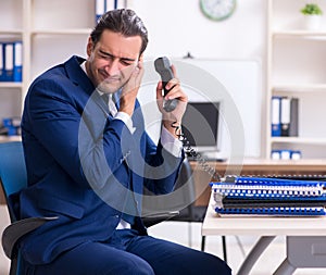 Young male businessman working in the office