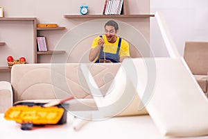 Young male carpenter stealing jewelry at home