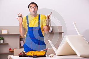 Young male carpenter stealing jewelry at home