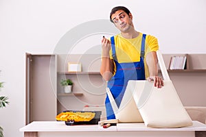 Young male carpenter stealing jewelry at home