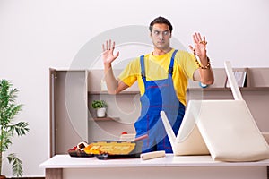 Young male carpenter stealing jewelry at home