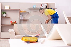 Young male carpenter stealing jewelry at home