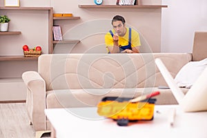 Young male carpenter stealing jewelry at home