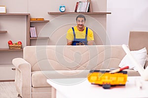 Young male carpenter stealing jewelry at home