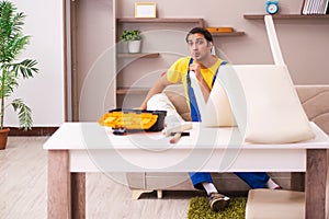 Young male carpenter stealing jewelry at home