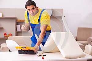 Young male carpenter stealing jewelry at home