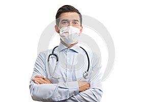 Young male caucasian doctor with stethoscope posing with crossed arms isolated on white