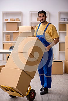 Young male contractor doing home relocation