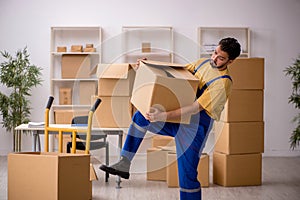 Young male contractor doing home relocation