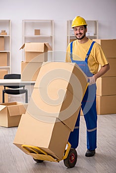 Young male contractor doing home relocation