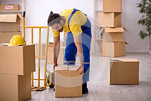 Young male contractor doing home relocation