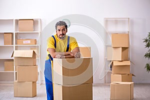 Young male contractor doing home relocation