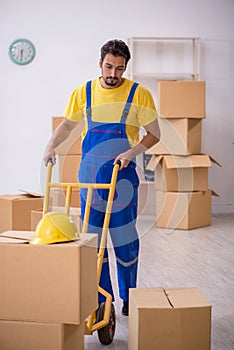 Young male contractor doing home relocation