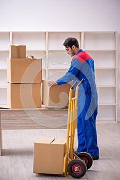 Young male contractor doing home relocation