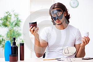 Young male cosmetician recording video for his blog