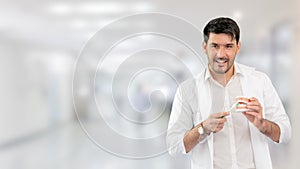 Young male dentist working in dental clinic.