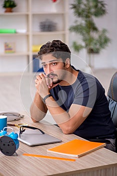 Young male designer working in the office