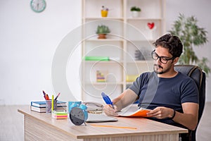 Young male designer working in the office