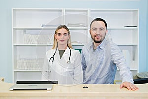 Young male doctor with colleague at doctor`s office. Doctor. Work. Boss.