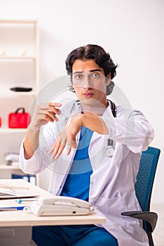 The young male doctor with goniometer