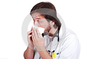 Young male doctor got fly and cleaning his nose wi