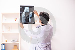 The young male doctor radiologist working at the clinic