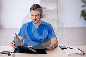 Young male doctor radiologist working in the clinic